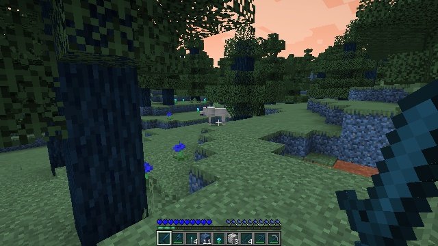 A Minecraft hillside at dusk with a small pale animal in the distance.